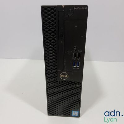 a dell dell desktop computer is sitting on a white surface