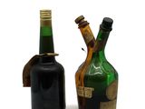 two bottles of wine sitting next to each other on a table