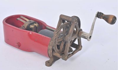 a small red box with a wine opener on it