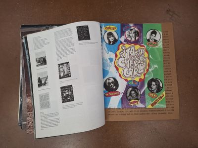 an open book with pictures of people on it