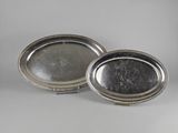 a pair of silver plate trays with beaded edges