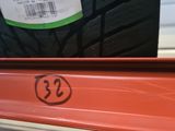 a close up of a tire on a shelf in a store