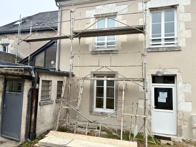 an image of a house being built with scaffolding