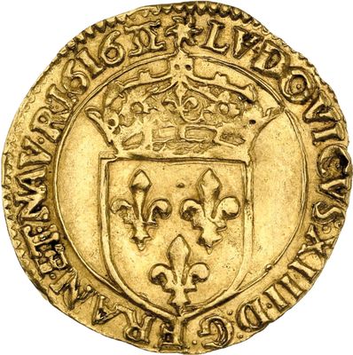 a gold coin with a crown on top of it