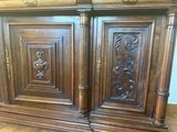 a wooden cabinet that has two doors on it