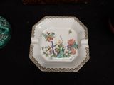 a plate with flowers on it sitting on a table