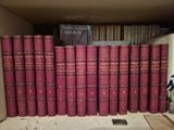 a lot of books that are sitting on a shelf