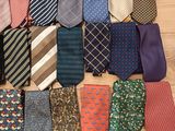 many ties laid out on the floor together