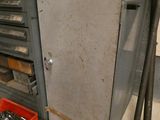 an image of a metal cabinet with tools in it