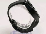a close up of a watch on a clear stand