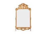une image d'un miroir encadré d'or sur un fond blanc