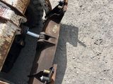 a rusted old truck sitting in the dirt