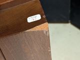 a knife that is sitting on top of a wooden block