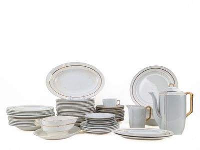 a lot of plates and cups on the table