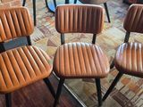four chairs that are sitting in a room