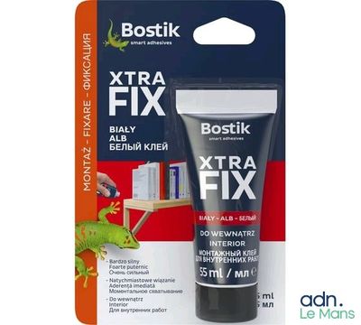 un gros plan d'un tube de dentifrice à côté d'un paquet de dentifrice