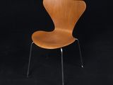 an image of a wooden chair against a black background
