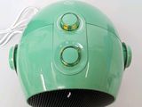 a green speaker that is sitting on a table