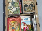 boxes of children ' s books are stacked on top of each other