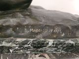 a close up of a statue of a person on a horse