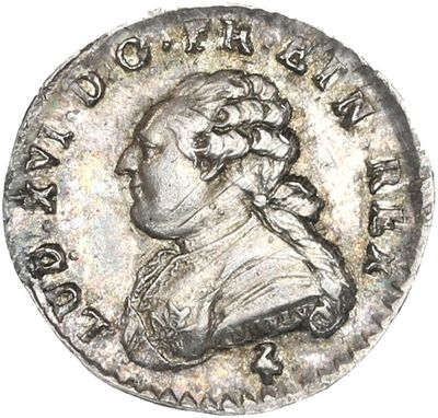 une pièce en argent portant le portrait d'un homme