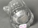 a glass cup that is sitting on a table