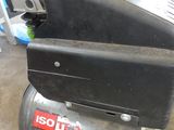 a black air compressor sitting in a garage