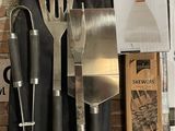 a lot of kitchen utensils that are sitting on a table