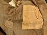 a brown jacket with a tan pocket on it