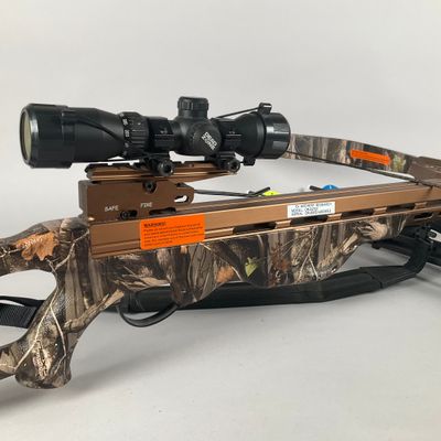 a close up of a rifle with a scope on a white background