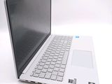a white laptop computer sitting on top of a white table
