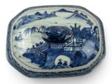 a blue and white plate with a bird on it