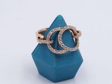a close up of a diamond ring on a blue ring holder