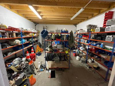 a garage with a lot of tools on the shelves