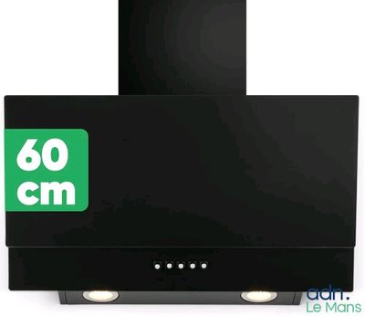 a close up of a black stove top oven with a green sign on it