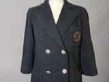 jacket on a mannequin stand with a white background