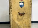an old suitcase sitting on the floor in a room