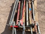 a pile of old tools on a pallet on the ground