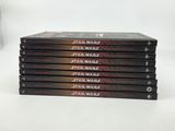 six dvd ' s stacked on top of each other on a white surface