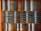 many forks and spoons in a wooden box