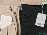 two pairs of pants and a t - shirt with a price tag on them