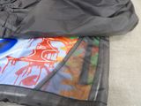 a black jacket with a picture of a horse on it