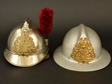 two helmets that are sitting next to each other on a table