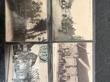 four old black and white photos of a street and buildings