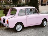 a pink car that is parked on the side of the road