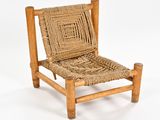 chair made of wood and wicker with a woven seat and back
