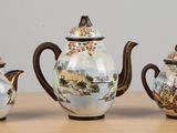 three different types of teapots sitting on a table