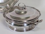 silverplated serving dish with lid and cover on a white surface