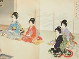 three women in kimono sitting on the floor in a room