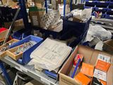 many boxes of assorted items on a shelf in a warehouse